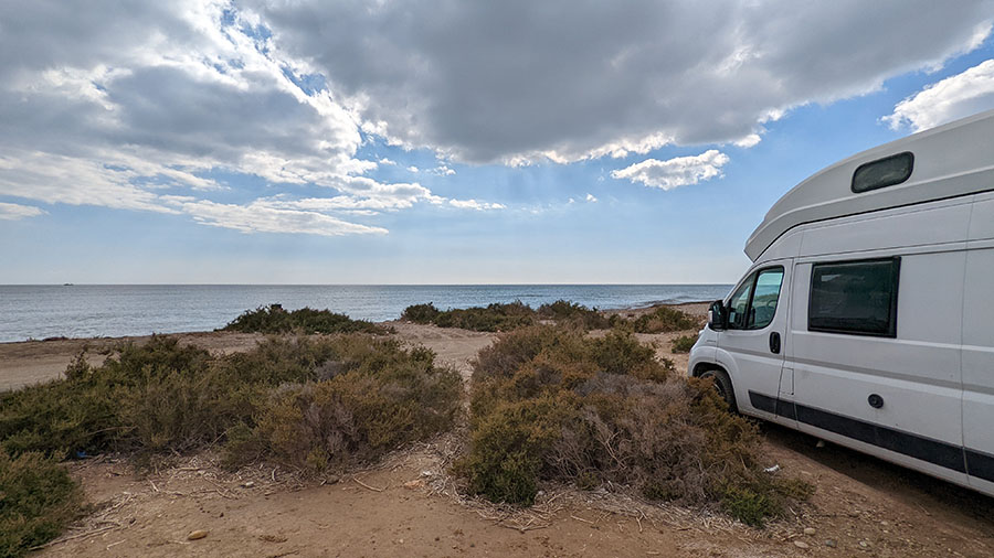 Van on beach in Spain.